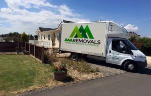 AAA Removals house clearances and storage van parked on a residential street